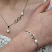 Bracelet acier inoxydable et perle d'eau douce, symbole infini pour mariage